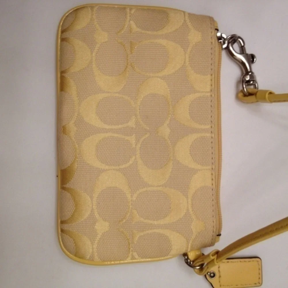 Coach yellow signature C wristlet Jacquard